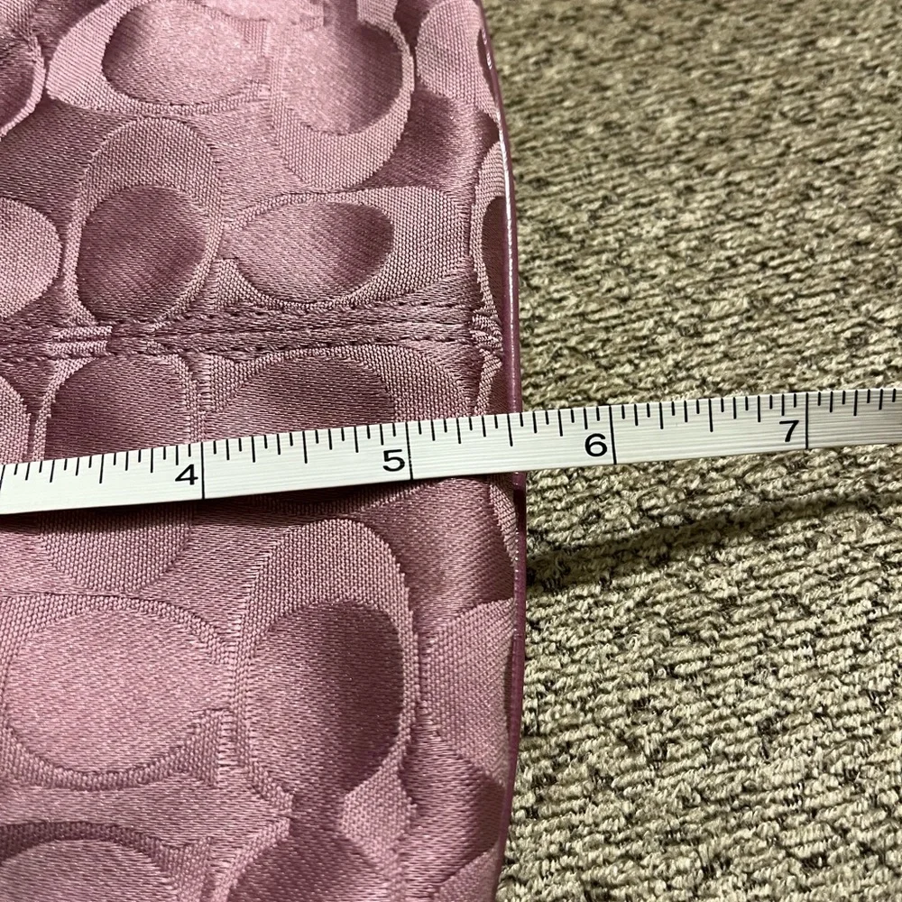 Coach wristlet.  EUC. Pinkish/mauve color.  Approximately 8.5 x 5.5